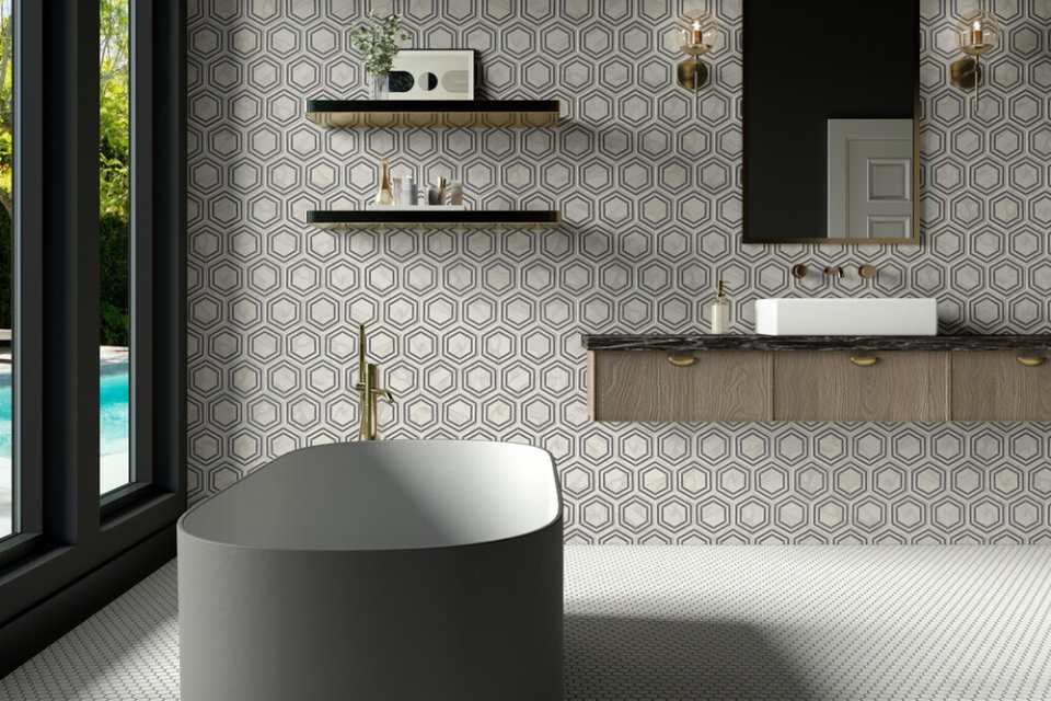 black and white hexagon backsplash in maximalist bathroom with deep soak tub and penny tile floors